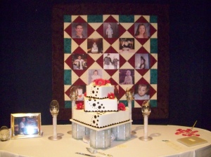 Beautiful Cake Table with childhood photo quilt